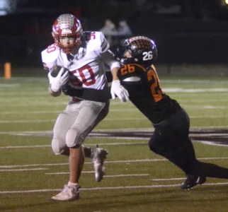 Hawken holds off Howland in OT